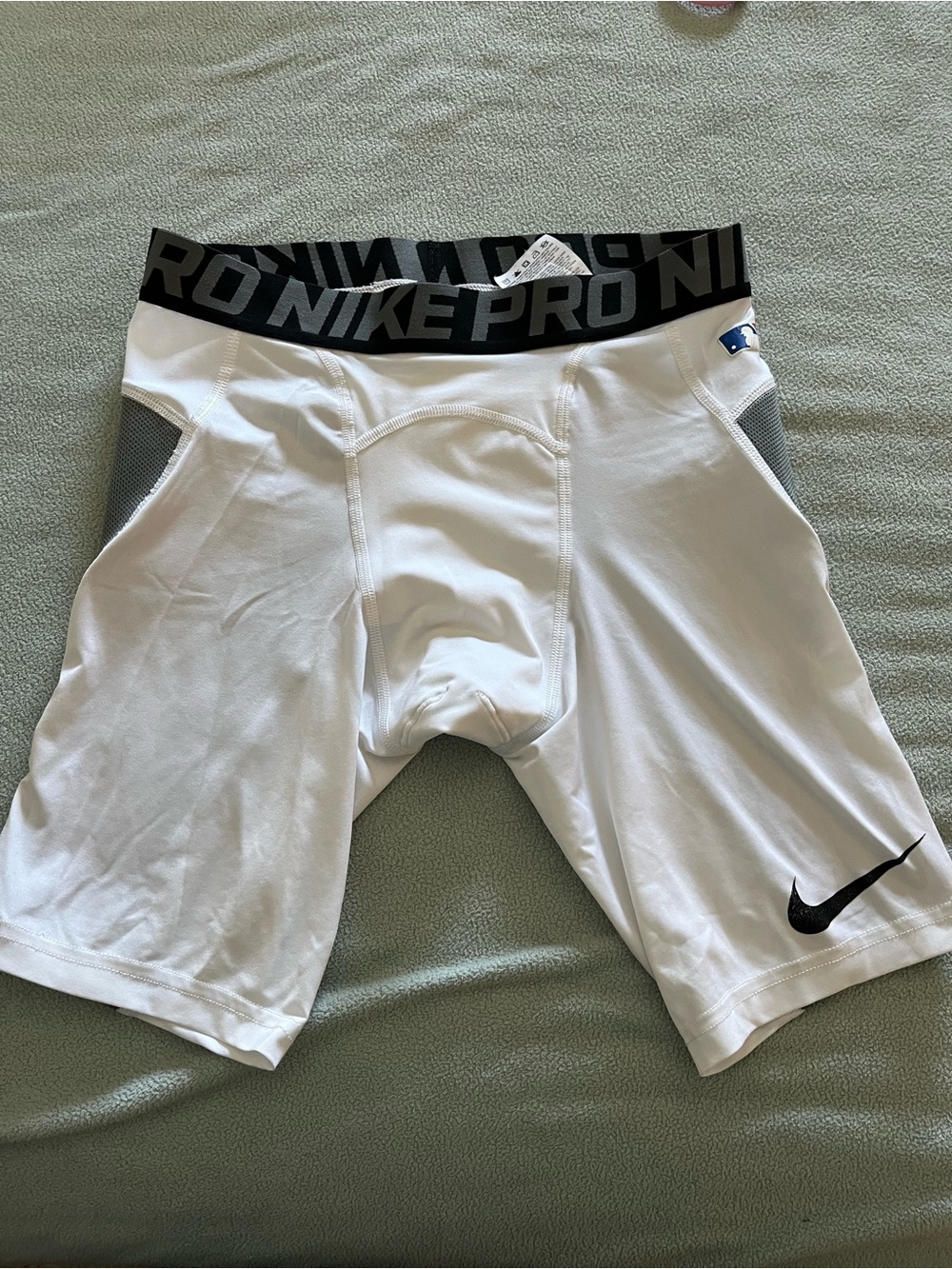 Nike White Compression Shorts with Black Waistband and Swoosh